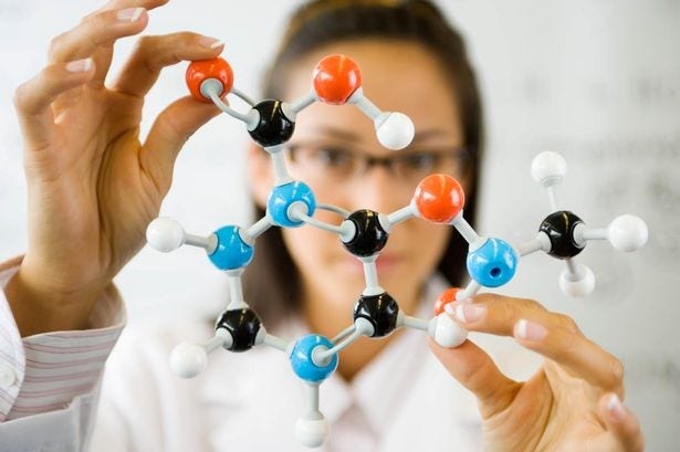 Student building a module of a molecule.